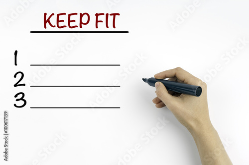 Hand with marker. KEEP FIT blank list, health concept