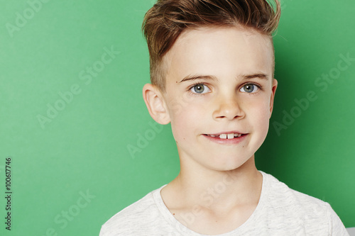 Confident young kid looking at camera