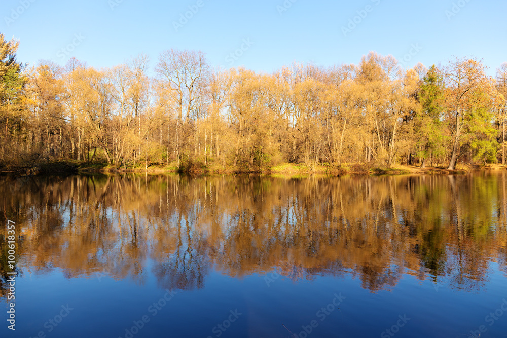 autumn landscape with symmetrical reflection