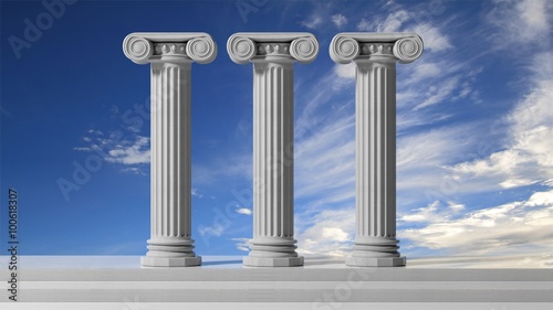 Fotografie Three ancient pillars with blue sky background.