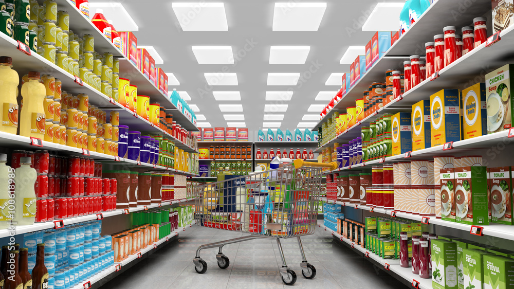 Supermarket interior, shelves with various products and full  trolley basket
