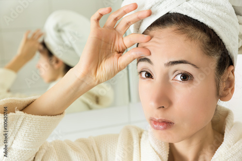Woman showing her forehead wrinkles