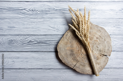 Sheaf of Wheat over Wood Background. Harvest concept.