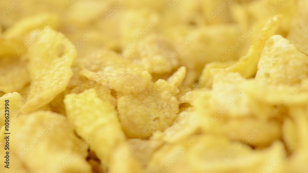 Cornflakes close-up with slow panning sliding motion. Concept of breakfast meal. Cornflakes close-up with slow panning sliding motion. Concept of breakfast meal.