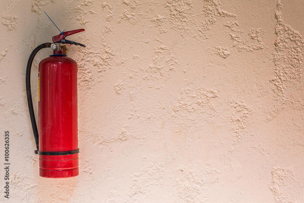 Obraz premium Red fire extinguisher.