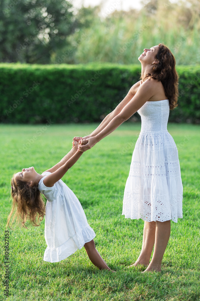 Mother and daughter are resting in the country side. Mother and daughter are resting in the country side.