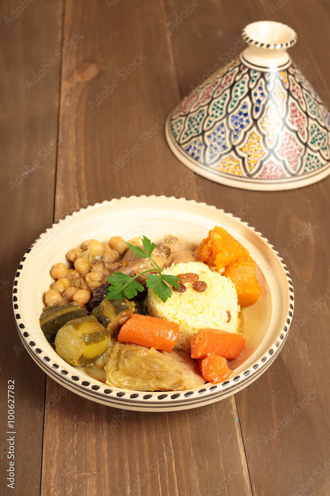 Couscous in a clay pot with drawings
