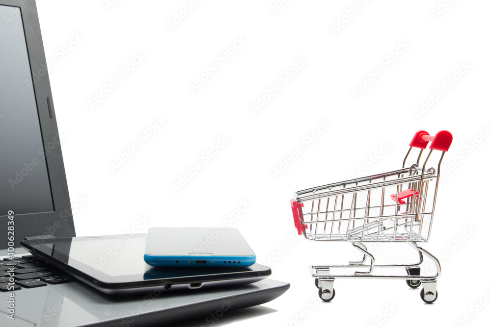 Online shopping concept - Empty Shopping Cart, laptop and tablet pc, smartphone isolated on white background. Copy space for text. Online shopping concept - Empty Shopping Cart, laptop and tablet pc, smartphone isolated on white background. Copy space for text.