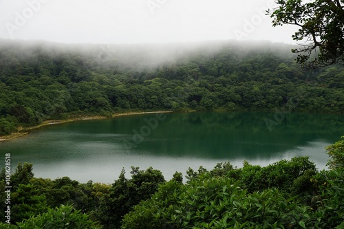 Beautiful lake in the crater of a volcano surrounded with tropical cloud forest, Costa Rica.