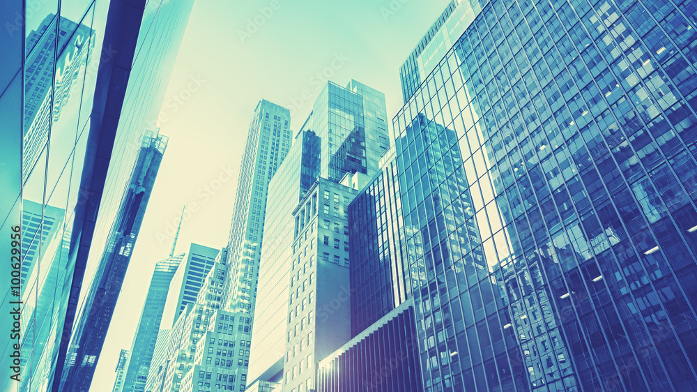 Futuristic blue toned Manhattan skyscrapers at sunset, NYC, USA. Futuristic blue toned Manhattan skyscrapers at sunset, NYC, USA.