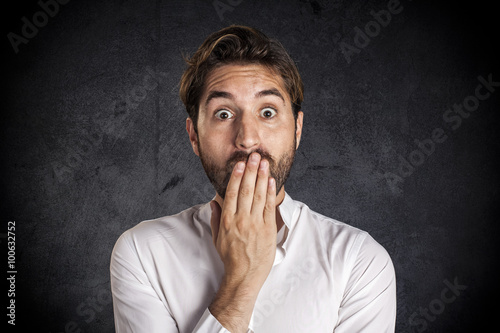 Astonished young businessman
