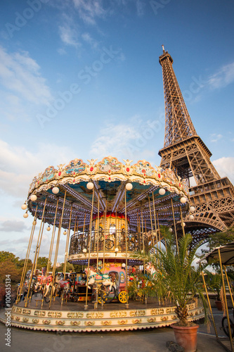 View at Champs de Mars in Paris with Eiffel Tower and carousel 