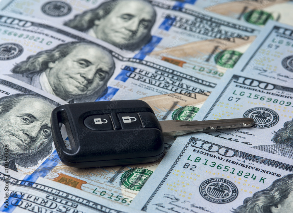 The United States dollars and car key The United States dollars and car key