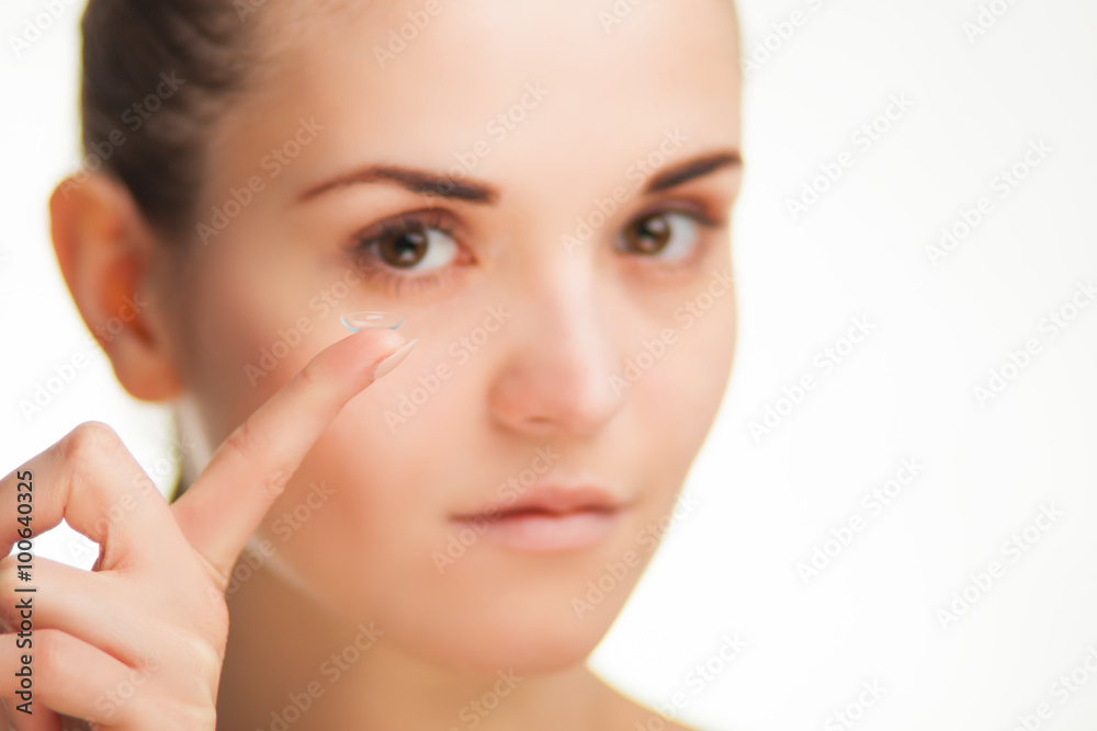 Woman with contact lens on finger healthcare concept Woman with contact lens on finger healthcare concept