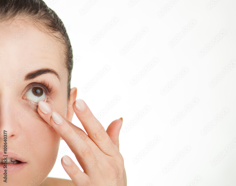Woman touching her eye concept of healthcare Woman touching her eye concept of healthcare