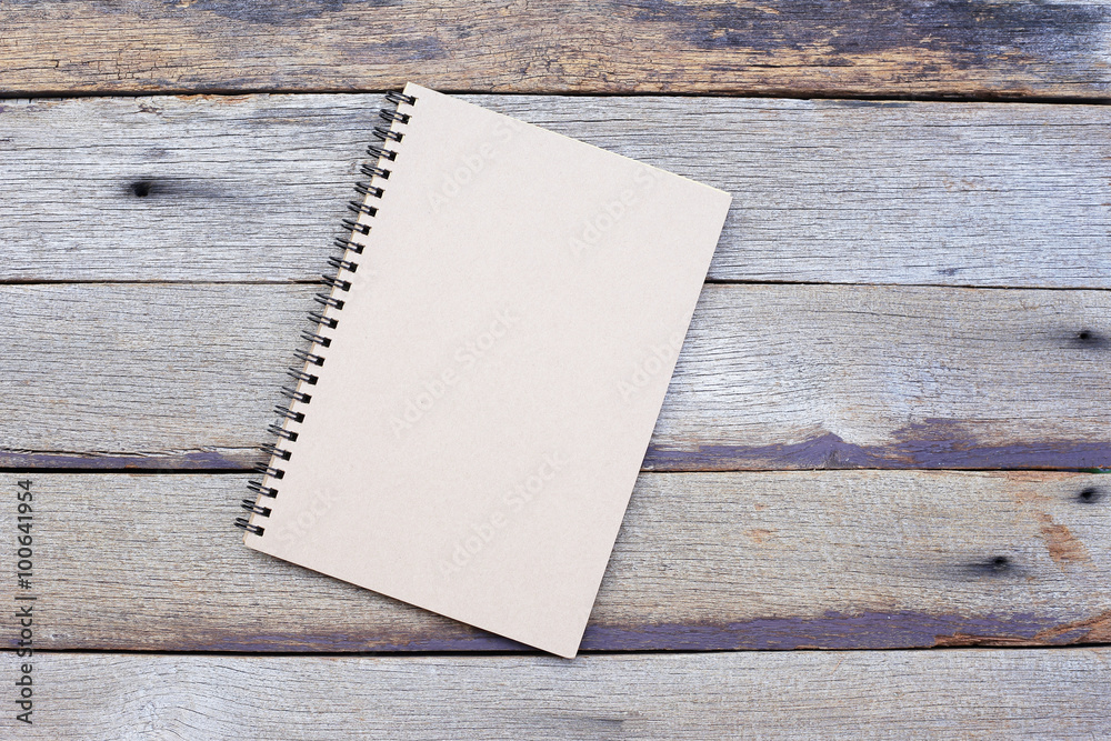 Notebook on wooden table Notebook on wooden table