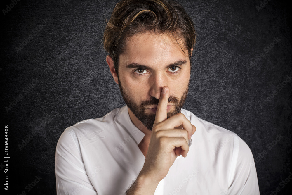 Young man asks for silence Young man asks for silence