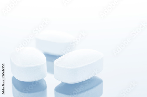 White medicine antibiotic pills.