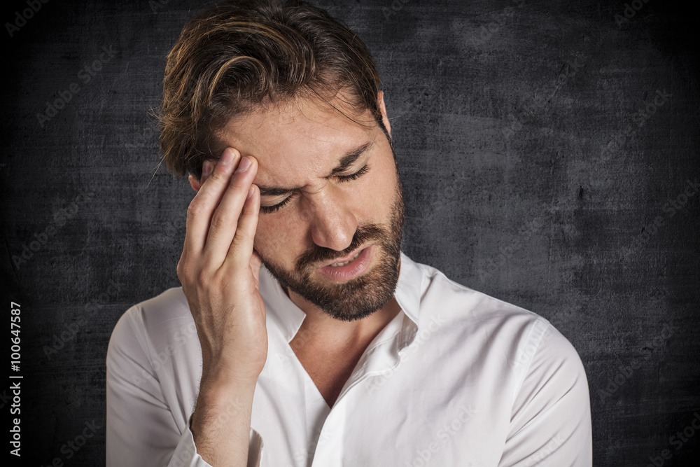 Stressed young businessman with hand on the head Stressed young businessman with hand on the head