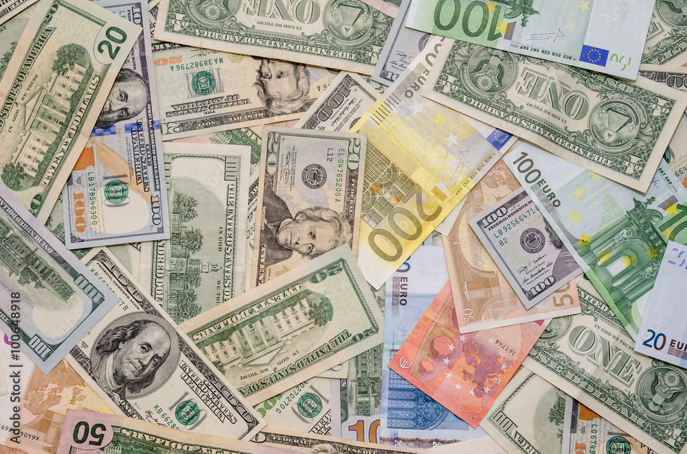 Pile of two leading currencies - US Dollar versus Euro as background Pile of two leading currencies - US Dollar versus Euro as background