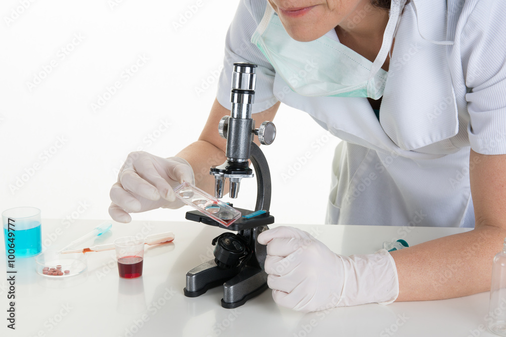 Portrait of a female researcher doing research in a lab Portrait of a female researcher doing research in a lab