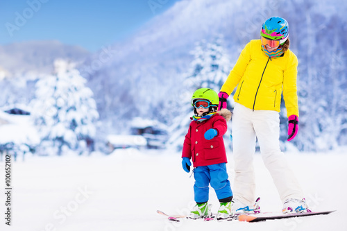Mother and little boy learning to ski
