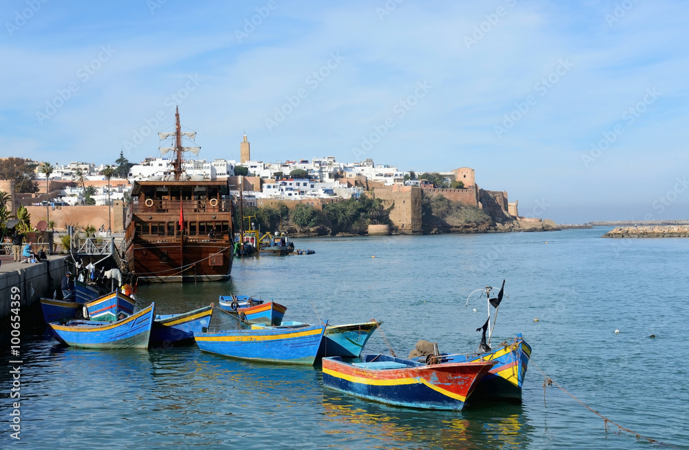 Rabat, Morocco - December 26, 2015:  Kasbah of the Udayas in Rabat. Traditional blue fishing boats in the foreground.