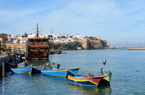 Rabat, Morocco - December 26, 2015: Kasbah of the Udayas in Rabat. Traditional blue fishing boats in the foreground.