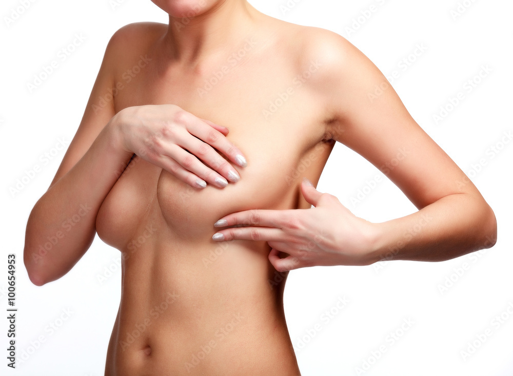 Female controlling breast for cancer, isolated on white Female controlling breast for cancer, isolated on white