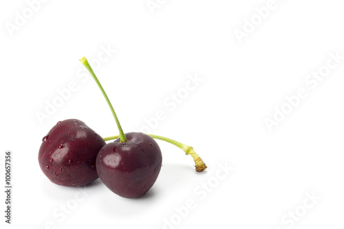 Two cherries isolated on white background