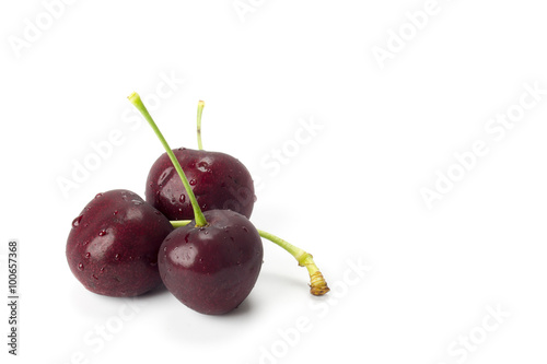 Three cherries isolated on white background