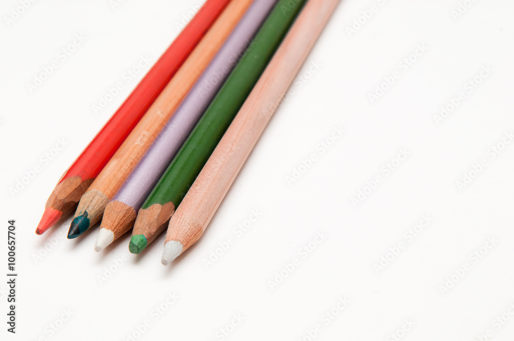 Five coloured pencils arranged on a white background Five coloured pencils arranged on a white background