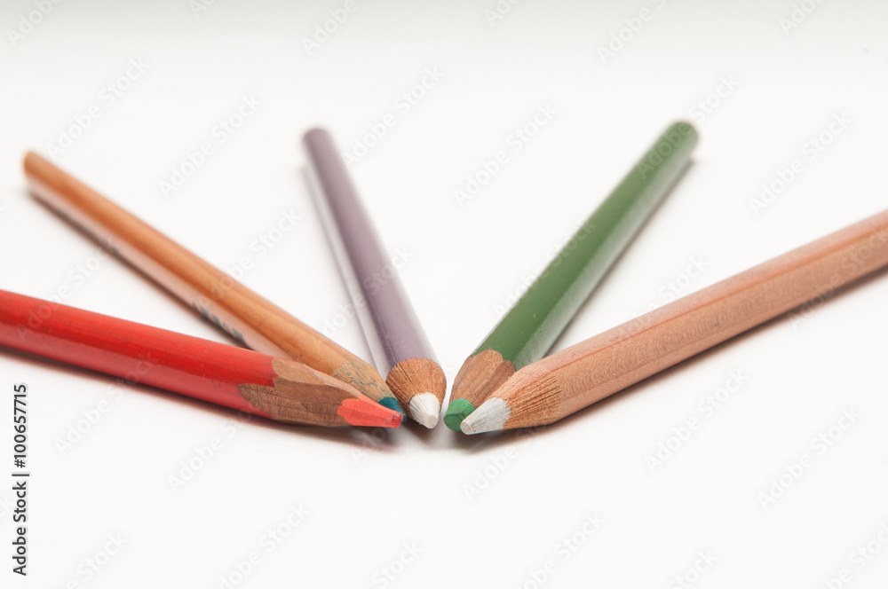 Five coloured pencils arranged on a white background Five coloured pencils arranged on a white background