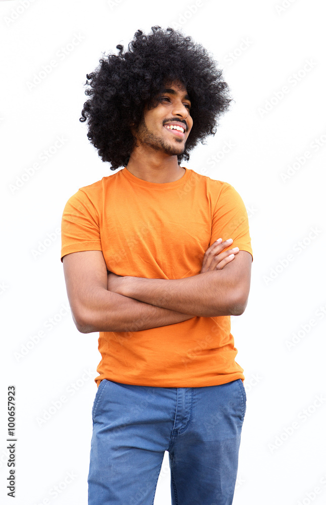Smiling black guy with arms crossed isolated on white background Smiling black guy with arms crossed isolated on white background