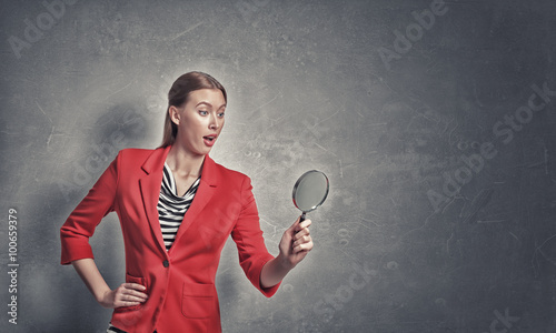 Girl using magnifier for search