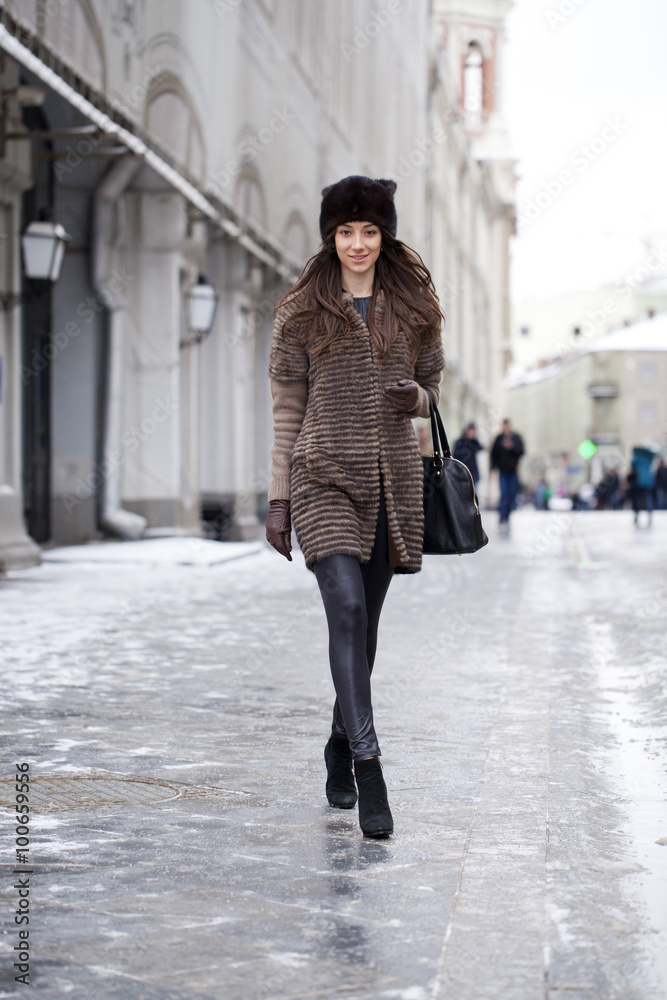 Young beautiful woman in stylish mink coat Young beautiful woman in stylish mink coat