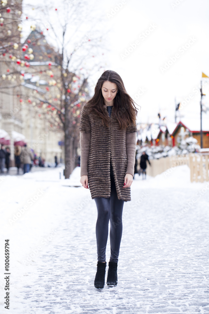 Young beautiful woman in stylish mink coat Young beautiful woman in stylish mink coat