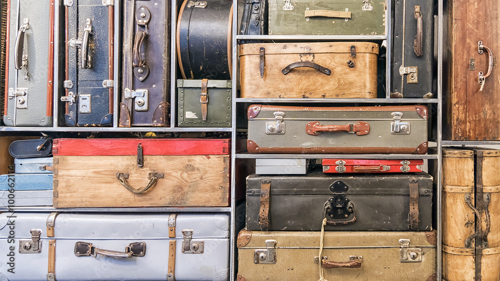 Pile of colorful vintage suitcases.