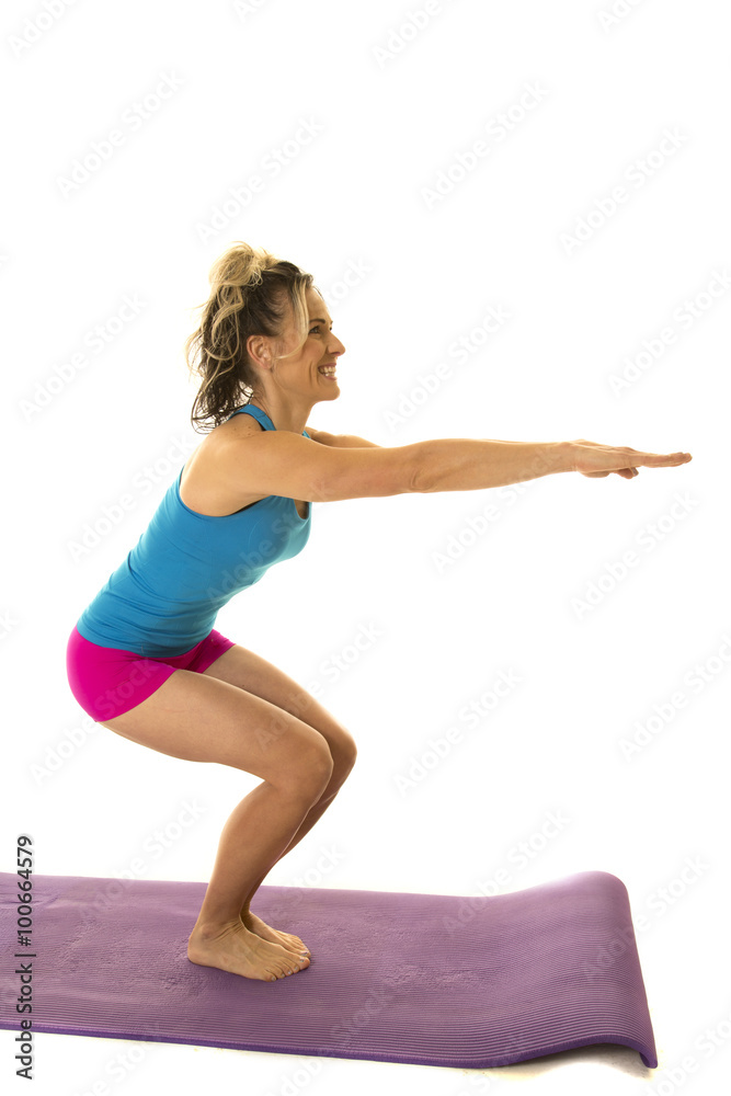 woman blue tank and pink shorts fitness side squat woman blue tank and pink shorts fitness side squat