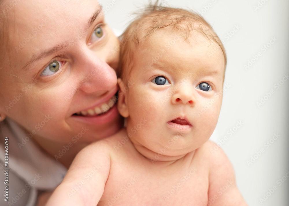 One month old newborn baby with mother One month old newborn baby with mother