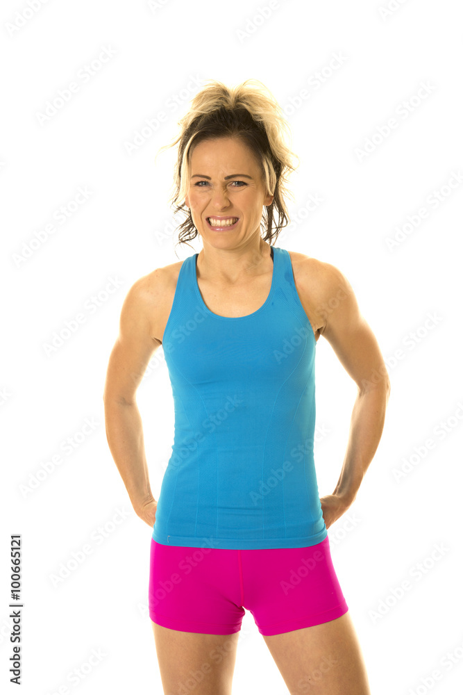 woman blue tank and pink shorts fitness stand smile woman blue tank and pink shorts fitness stand smile