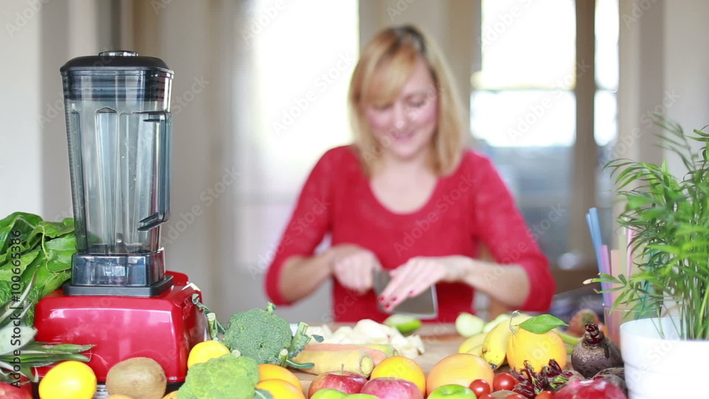 Woman cutting apple for smoothie Woman cutting apple for smoothie