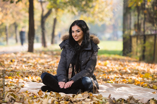 Portrait Of Beautiful Young Girl In Autumn Park