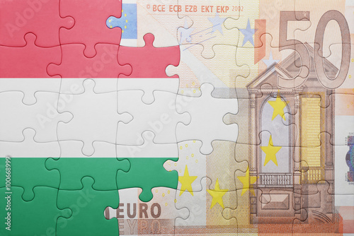puzzle with the national flag of hungary and euro banknote