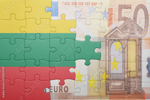 puzzle with the national flag of lithuania and euro banknote