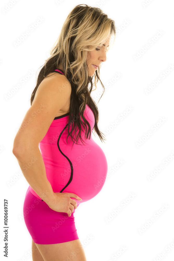 woman in pink fitness outfit pregnant side woman in pink fitness outfit pregnant side