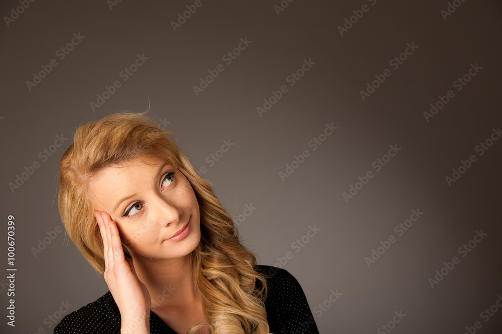 Pretty pensive caucasian blonde business woman looking into copy Pretty pensive caucasian blonde business woman looking into copy