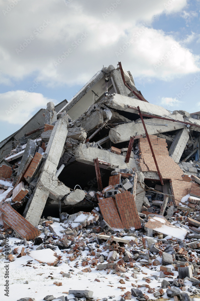 Rubble pile of wrecked building, blue sky and clouds, 2015. Rubble pile of wrecked building, blue sky and clouds, 2015.