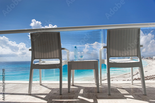 Balcony with wicker chairs and table