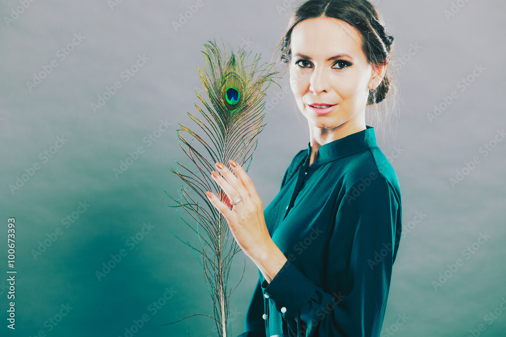 Fototapeta premium Girl with the peacock feathers